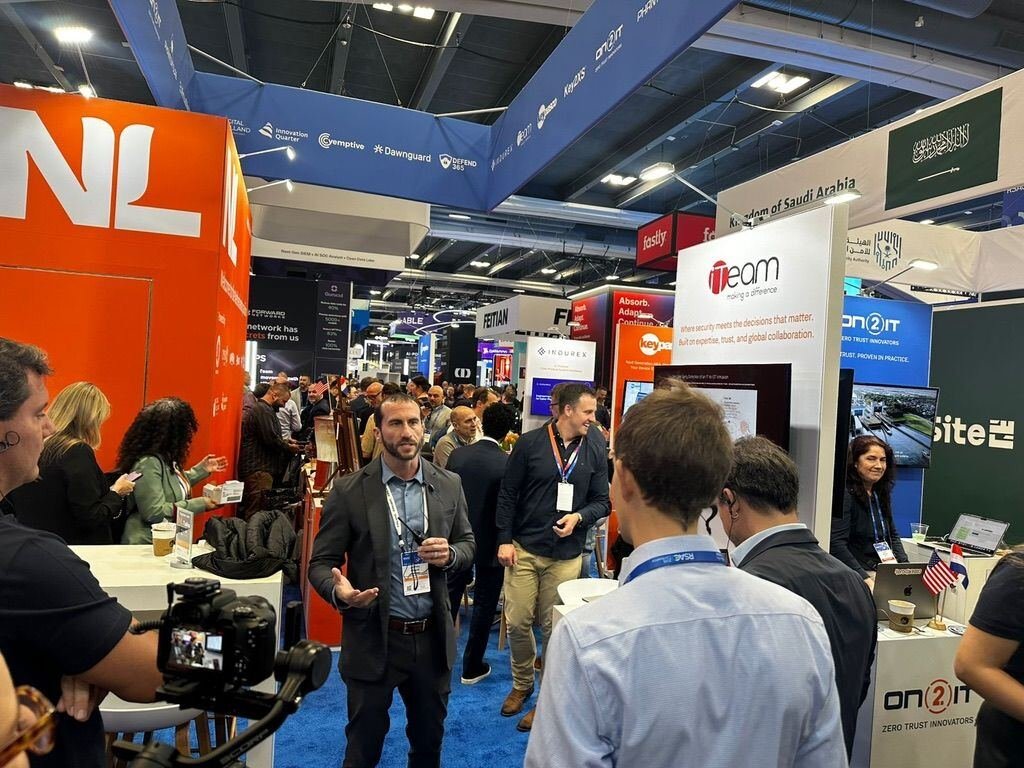 Jeffrey Macre interviewed on camera on the RSAC expo floor